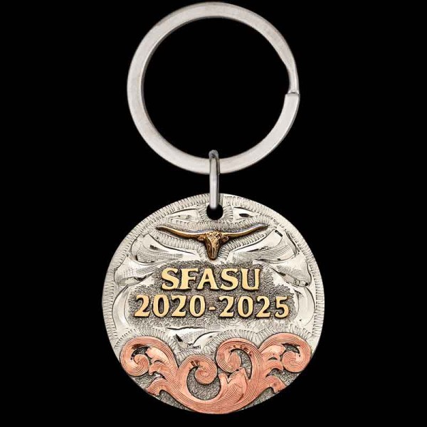"Our Country Strong Custom Keychain is as resilient as you are. Crafted on a German Silver base, it features a striking three-metal design with a Copper overlay showcasing Western scroll engraving and Jeweler's Bronze lettering. Designed to be custom